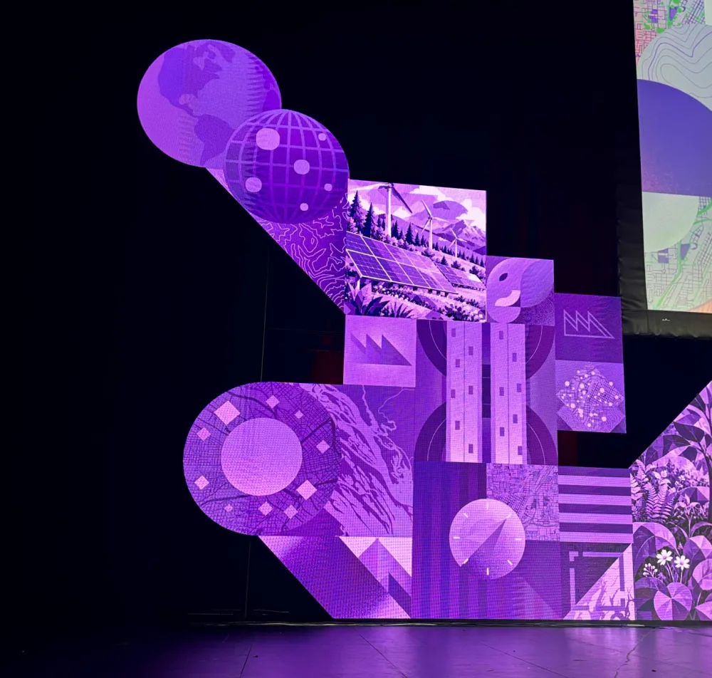 Geometric LED display panels arranged into a sculptural stage feature.