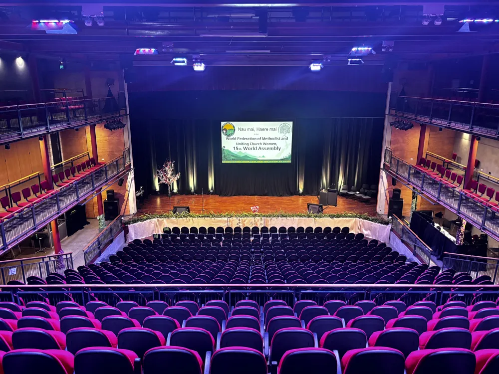 View across the tiered auditorium seating towards the stage at Due Drop Events Centre.